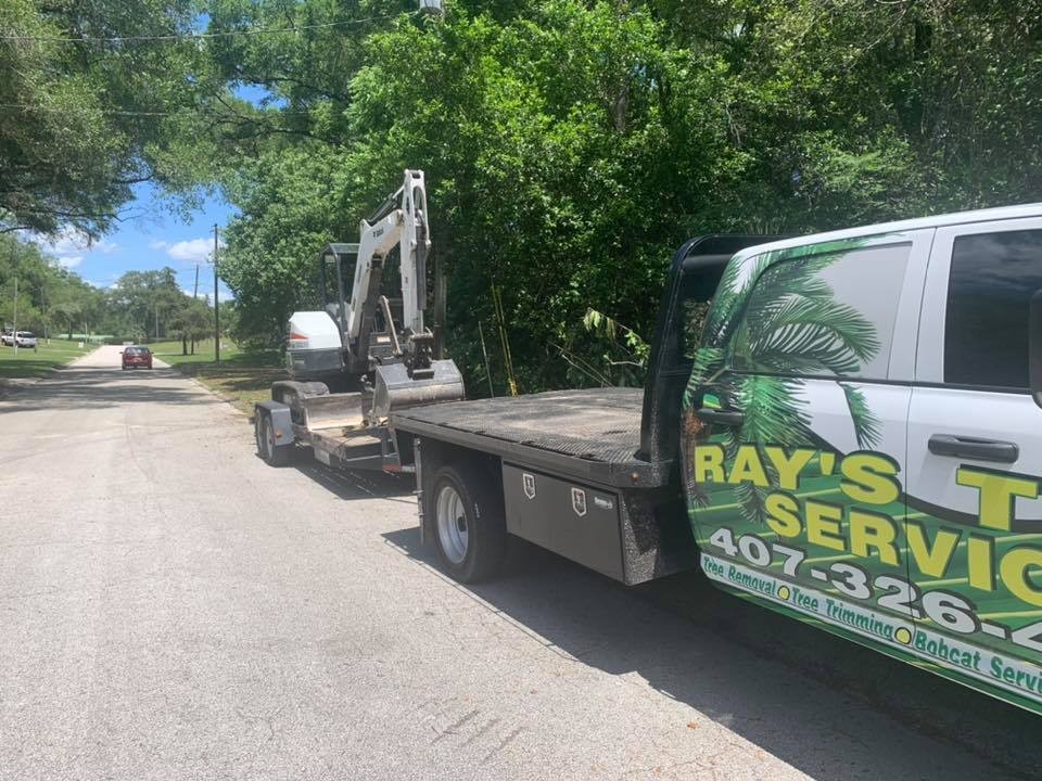 Ray's Tree Service family-owned crew in front of their chipper truck